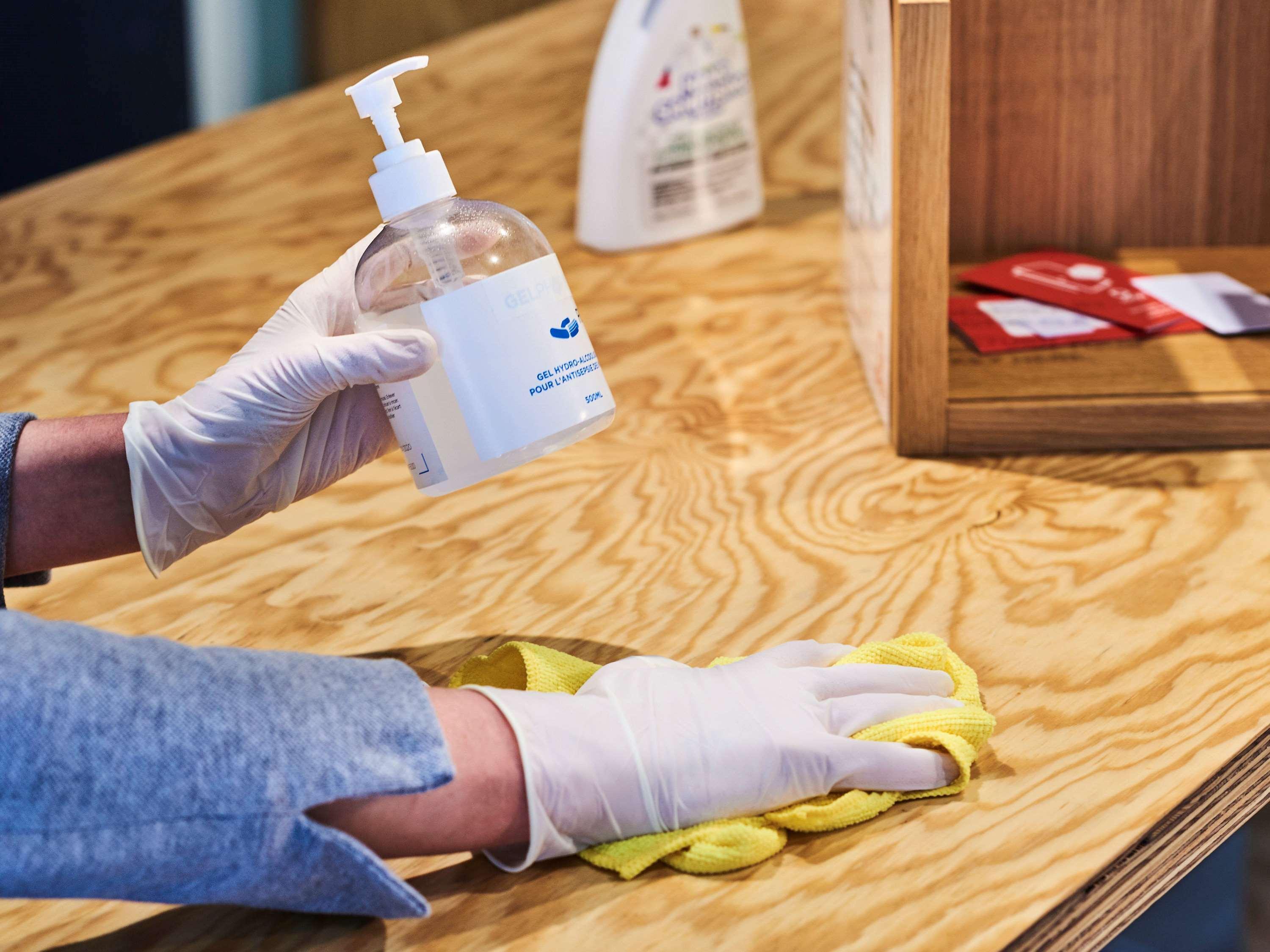 Novotel Chennai Chamiers Road Exterior foto Disinfection of a table with a disinfectant